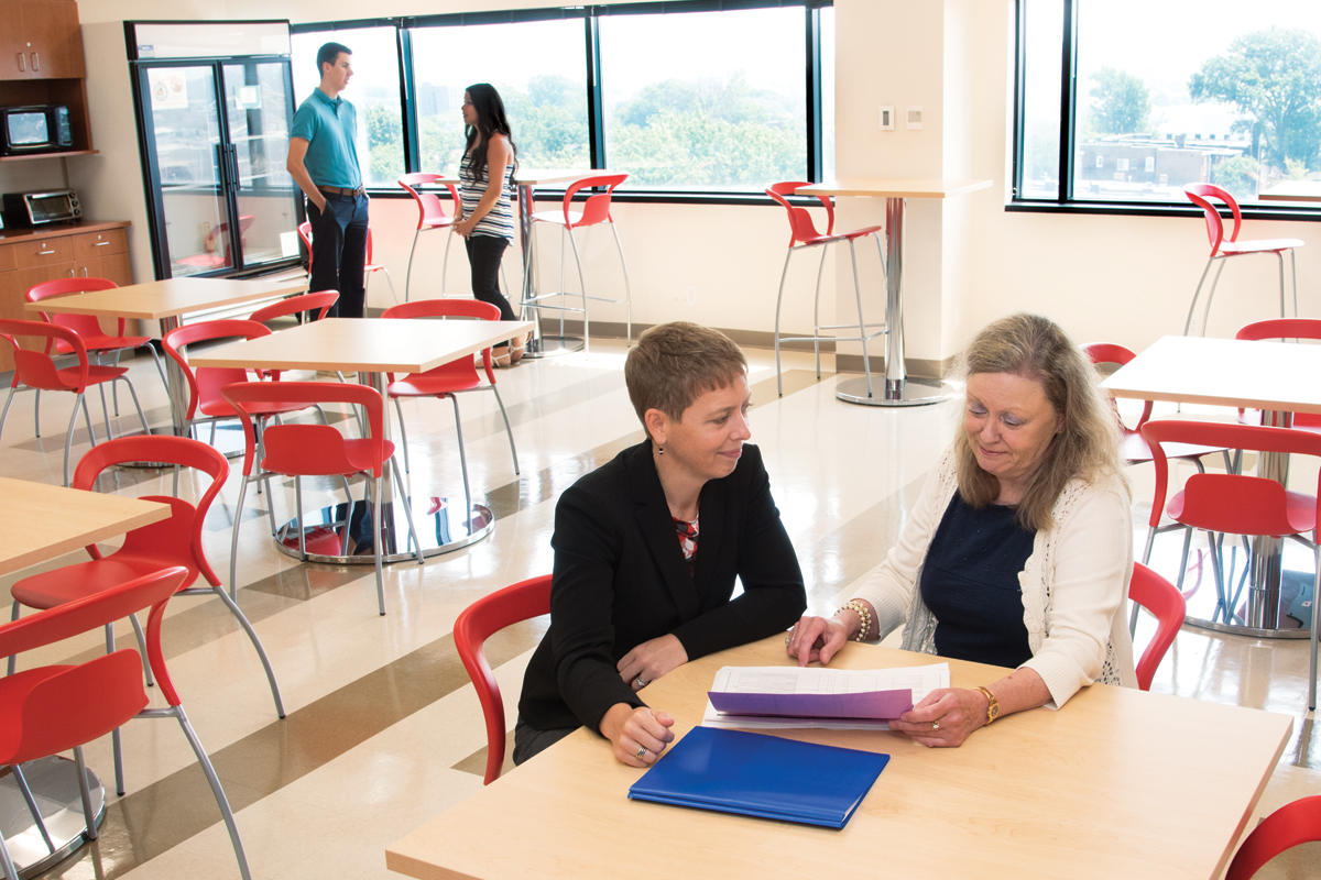 Gammon Earhart, PT, PhD (left), director of the Program in Physical Therapy, and Jennifer Stith, PT, PhD, LCSW, director of education, meet in the recently renovated student lounge that moved from the basement to the top floor of the 4444 Forest Park Building. 